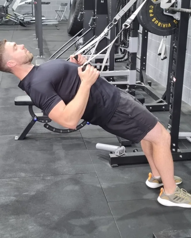Dan demonstrating a suspension row