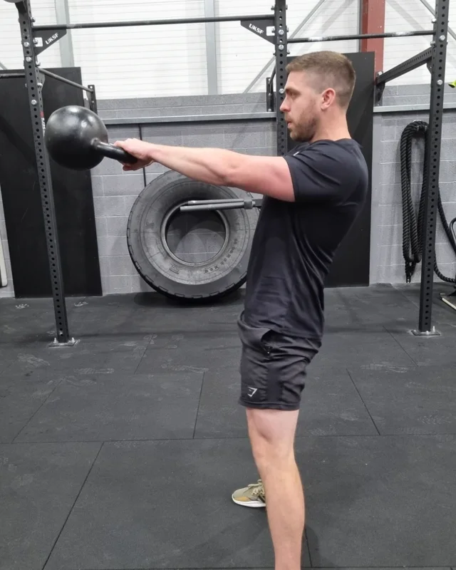 Dan demonstrating a kettlebell swing